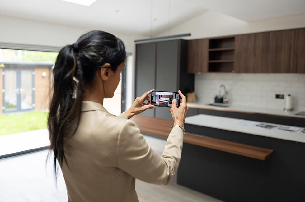 Person taking photos in kitchen